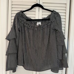 This super cute top can be worn off the shoulders or not.